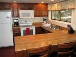 The kitchen has a breakfast bar. The fresh roasted whole bean coffee is compliments of Cielo Vista Vacation Properties 